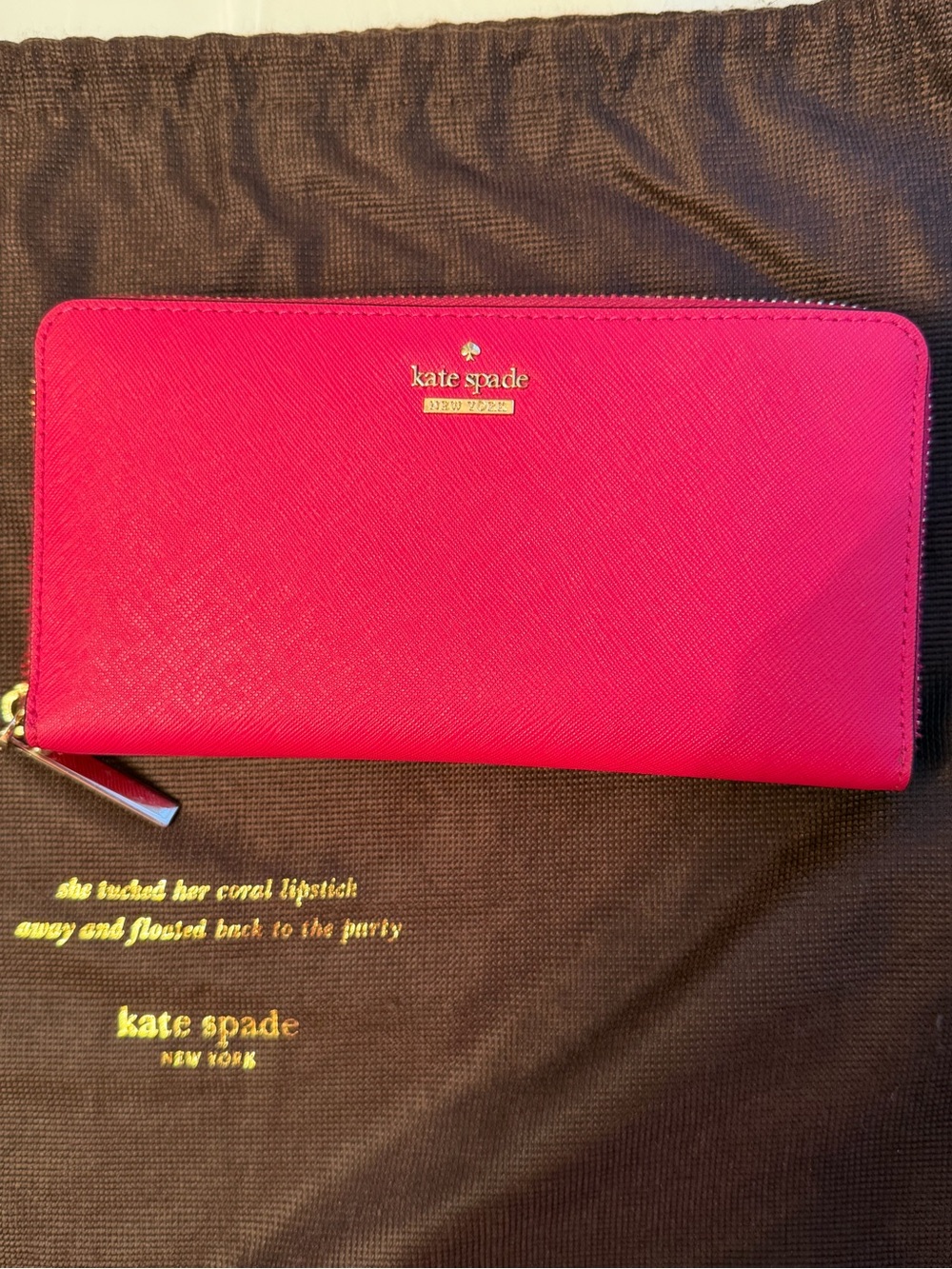 kate spade bright fuchsia zip-around wallet with gold logo